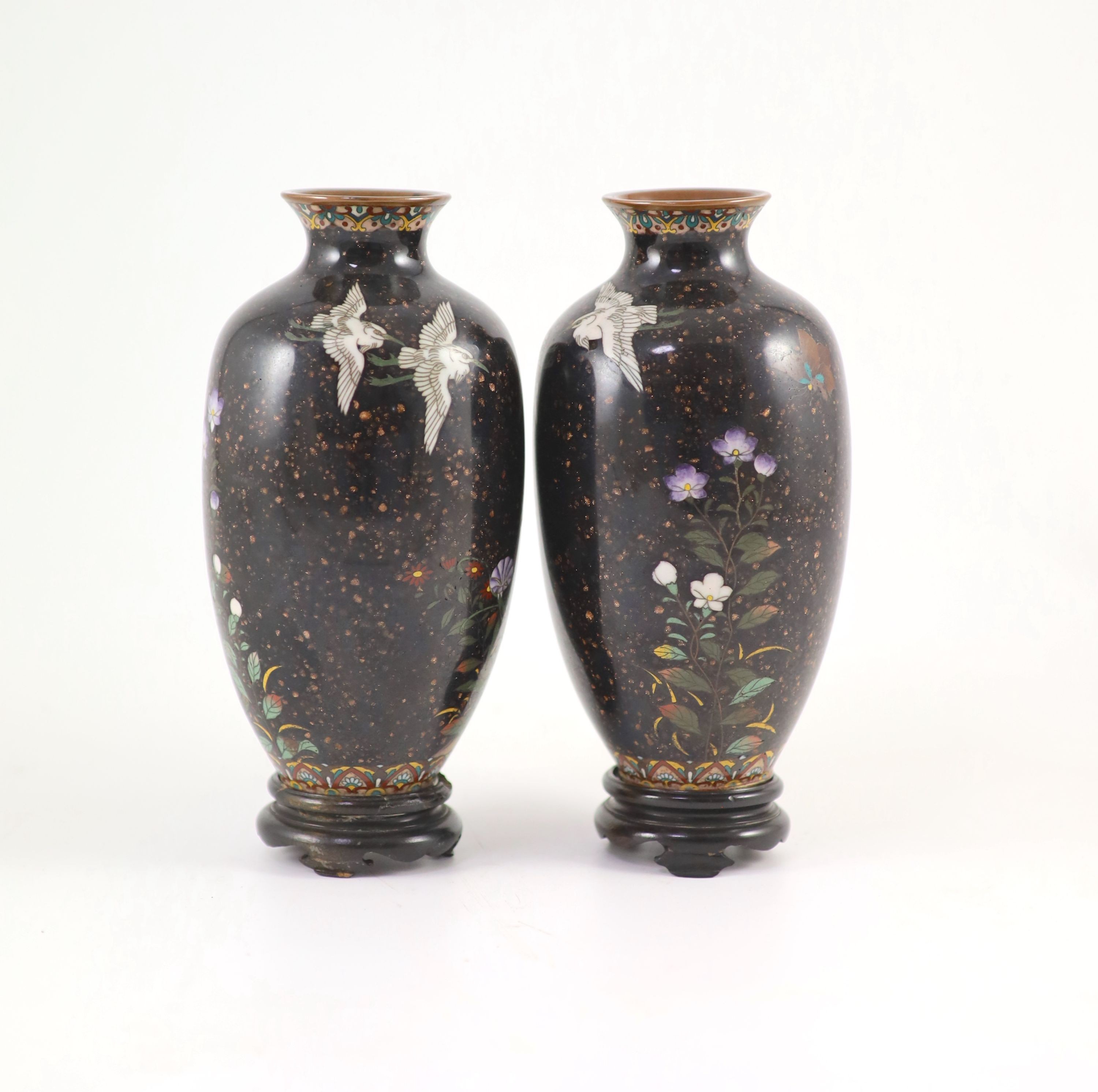 A pair of Japanese silver wire cloisonné enamel ‘egret’ vases, Meiji period, 18.5 cm high, wood stands